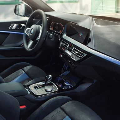Sporty BMW 1 Series interior. BMW 1 Series cockpit with M Sport seats, M Leather steering wheal and illuminated interior trim finishers.